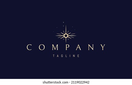 Vector golden logo on which an abstract image of a shining star with rays.