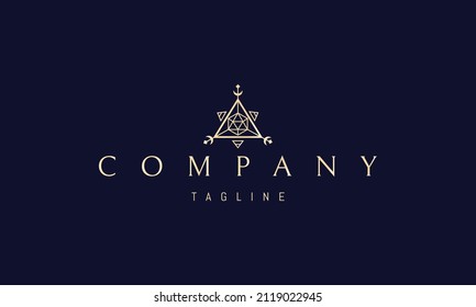 Vector golden logo on which an abstract image of an alchemical symbol in the form of a triangle.