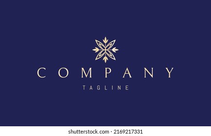 Vector golden logo on which an abstract image of a flower in the form of a cross.