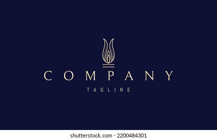 Vector golden logo on which an abstract image of two leaves in the form of a burning candle flame.