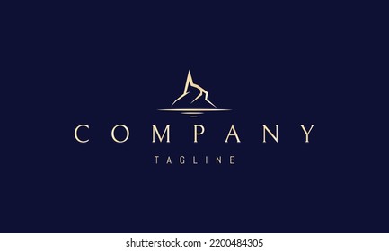 Vector golden logo on which an abstract image of a mountain and a lake in a minimalist style.