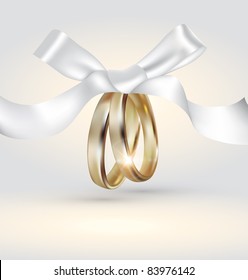 Vector golden wedding rings with ribbon