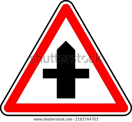 Vector graphic of a uk crossroad ahead road sign. It consists of a crossroad symbol contained within a red triangle