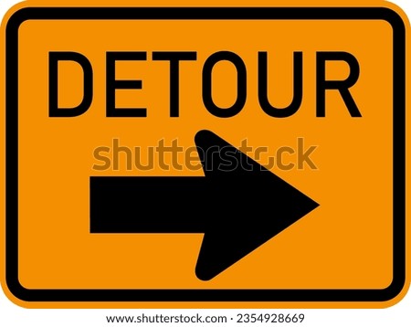 Detour signpost on an old wooden barrier fence on an asphalt road