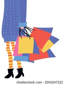 Vector graphics - a fashionable woman in casual clothes - in striped tights, a blue knitted oversize sweater and black boots with a hidden face carries in her hand a lot of colorful bags copyspace