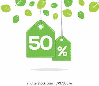 Vector green hanging price tag labels with 50% text on them and with shadow on white background with leaves. For spring sale campaigns. 