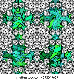 Vector green mehndi seamless pattern. Ornamental floral elements with henna tattoo, green stickers, mehndi and yoga design, cards and prints. Pattern on background with green elements.