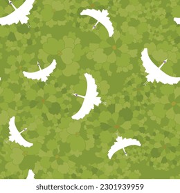 Vector green seamless pattern: From Above. Bigger and smaller cranes are circling above flower-like treetops in different shades of green. Part of The Flower Tree collection.
