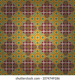 Vector green, yellow and orange seamless background pattern with rhombuses.