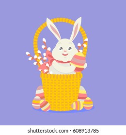 Vector greeting card. The Easter hare sits in a basket with mimosa and keeps the Easter egg