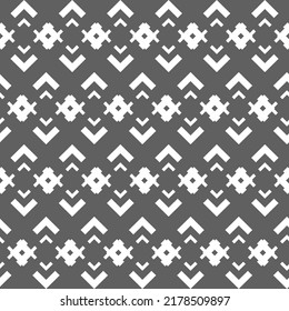 Vector. Grey and white abstract ethnic seamless pattern. Background of angle brackets. Mosaic. Design of packaging paper, textile printing, web design, cover, advertising and typographic products.