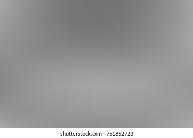 Vector greyscale blurred background. Monochrome defocused black and white smoky banner. Grayscale gradient. Grey or silver abstract backdrop. Blurry unfocused studio light, mist or fog illustration.