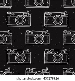 Vector grunge black and white vintage seamless pattern with retro photo cameras. Trendy hipster style