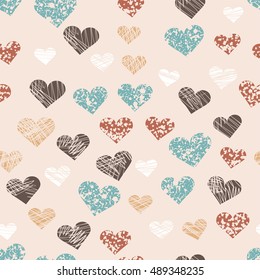 Vector grunge hearts in retro colors seamless pattern for textille