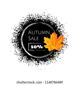 Vector grunge illustration with text autumn sale 50% on the blot of black paint. Orange maple leaf on the right. Isolated on the white background.