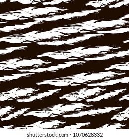 Vector grunge seamless texture with imprints of a dry brush on a black background.