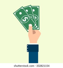 vector hand in blue suit holding a wad of green dollars on yellow background