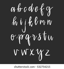 Vector hand drawn alphabet. Dry brushed white font isolated on black background