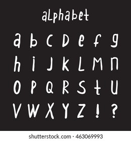 Vector hand drawn alphabet. Isolated on a black background. Handwritten script alphabet. Hand lettering typography for your designs