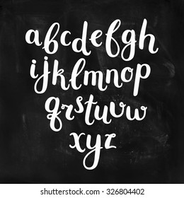 Vector Hand Drawn Alphabet on chalkboard. Letters written with a brush pen. Ink abc