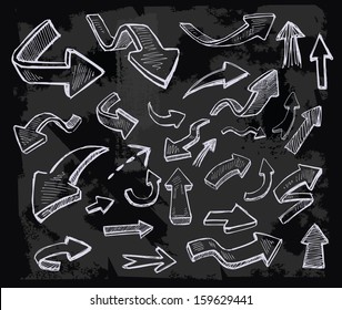 vector hand drawn arrows icons set on chalkboard