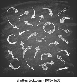 Vector hand drawn arrows icons set on chalkboard. Abstract vector illustration.