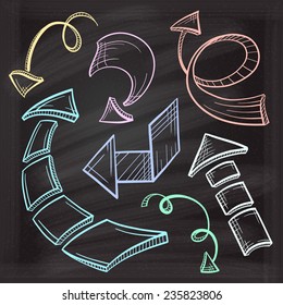 Vector hand drawn arrows icons set on chalkboard