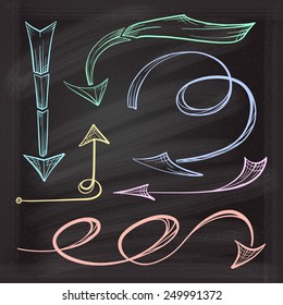 Vector hand drawn arrows icons set on chalkboard