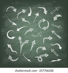 Vector hand drawn arrows icons set on the green blackboard. Abstract vector illustration.