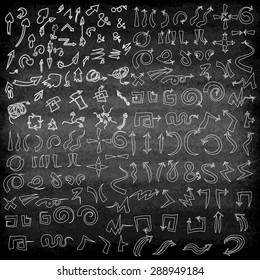 Vector hand drawn arrows icons set on the black blackboard or chalkboard. Abstract vector illustration.