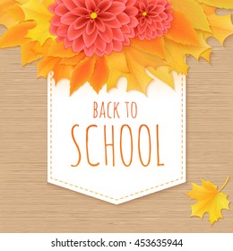 vector hand drawn back to school lettering with paper banner, realistic maple leafs, dahlia flowers and greetings label on wooden background. Can be used as card or poster.