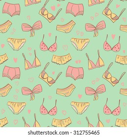 Vector hand drawn bra and panties seamless pattern on green background, color women underwear Illustration