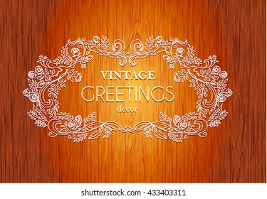 vector hand drawn calligraphic  vignette. The pattern of the branches of the roses. Wooden background.Pattern border Floral ornament of leaves and flowers.Vintage style frame.