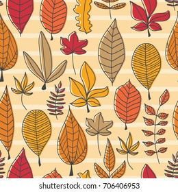 Vector hand drawn doodle seamless background with autumn leaves.
