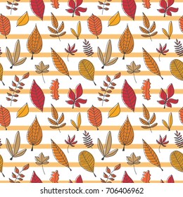 Vector hand drawn doodle seamless background with autumn leaves.