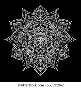 Vector hand drawn doodle tribal mandala. Ethnic mandala with ornament and dots. Isolated. White snowflake on black background. Outline.