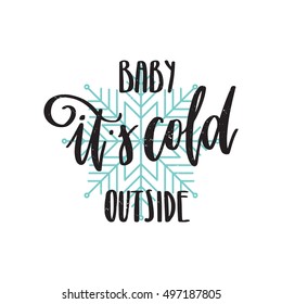 Vector hand drawn greeting card - Baby it's cold outside. Black calligraphy isolated on white background with blue snowflake