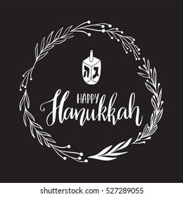 Vector hand drawn greeting card - Happy Hanukkah. White calligraphy isolated on black background with dreidel. Hand lettering illustration. Hanukkah design