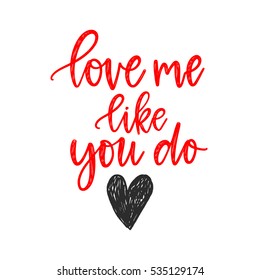 Vector hand drawn greeting card - Love me like you do. Red calligraphy isolated on white background. Valentine's Day design