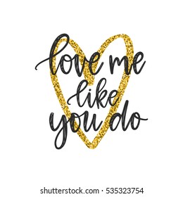 Vector hand drawn greeting card - Love me like you do. Black calligraphy isolated on white background with golden glitter heart. Valentine's Day design