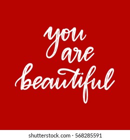 Vector hand drawn greeting card - You are beautiful.White calligraphy isolated on red background. Valentine's Day design