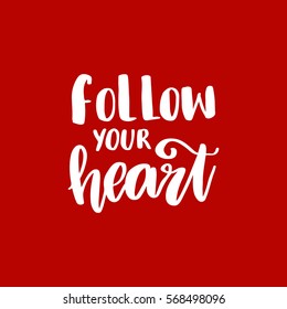 Vector hand drawn greeting card - Follow your heart.White calligraphy isolated on red background. Valentine's Day design