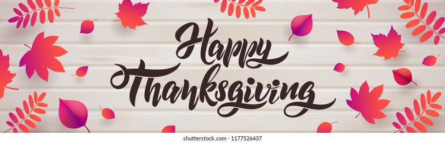 Vector Hand drawn Happy Thanksgiving typography flyer. Celebration quotation for greeting card. Vector vintage style autumn calligraphy. Lettering text Thanksgiving, fallen leaves on wood background