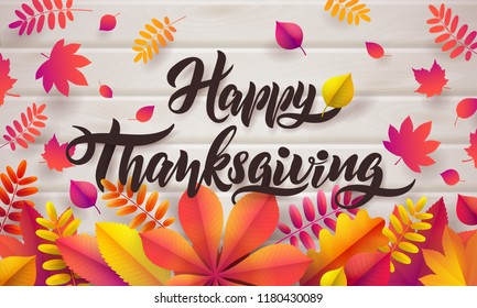Vector Hand drawn Happy Thanksgiving typography poster. Celebration quotation for greeting card. Vector vintage style autumn calligraphy. Lettering text Thanksgiving, fallen leaves on wood background