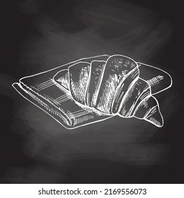 Vector hand drawn illustration of croissant. White sketch isolated on black chalkboard. Sketch icon and bakery element for print, web, mobile and infographics.