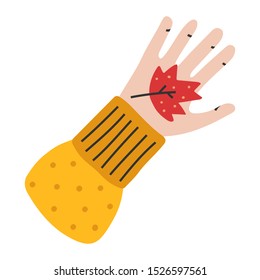 Vector hand drawn illustration of red autumn leaf laying on palm, seasonal autumn symbol. Doodle icons in modern trendy flat cartoon style.