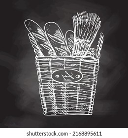 Vector hand drawn illustration of wicker square basket with baguettes. White sketch isolated on black chalkboard.  Sketch icon and bakery element for print, web, mobile.