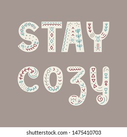 Vector hand drawn lettering design - Stay cozy inscription with decorative elements in scandinavian stile 