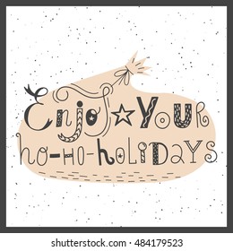 Vector hand drawn lettering sign Enjoy your hohoholidays with gift bag. Text design for greetings, card, invintations or postcards. Funny hand drawn font. Calligraphy collection.
