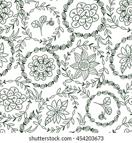 Vector hand drawn monochrome seamless pattern with doodle flowers and branches around it